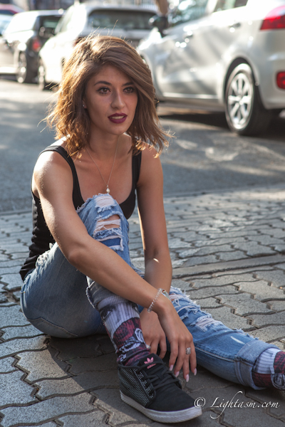 Trendy Instagram Model sitting in the street