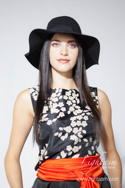 Model Wearing Hat in Fashion Photoshoot